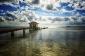 Dock going into the ocean at sunset in Belize – Best Places In The World To Retire – International Living